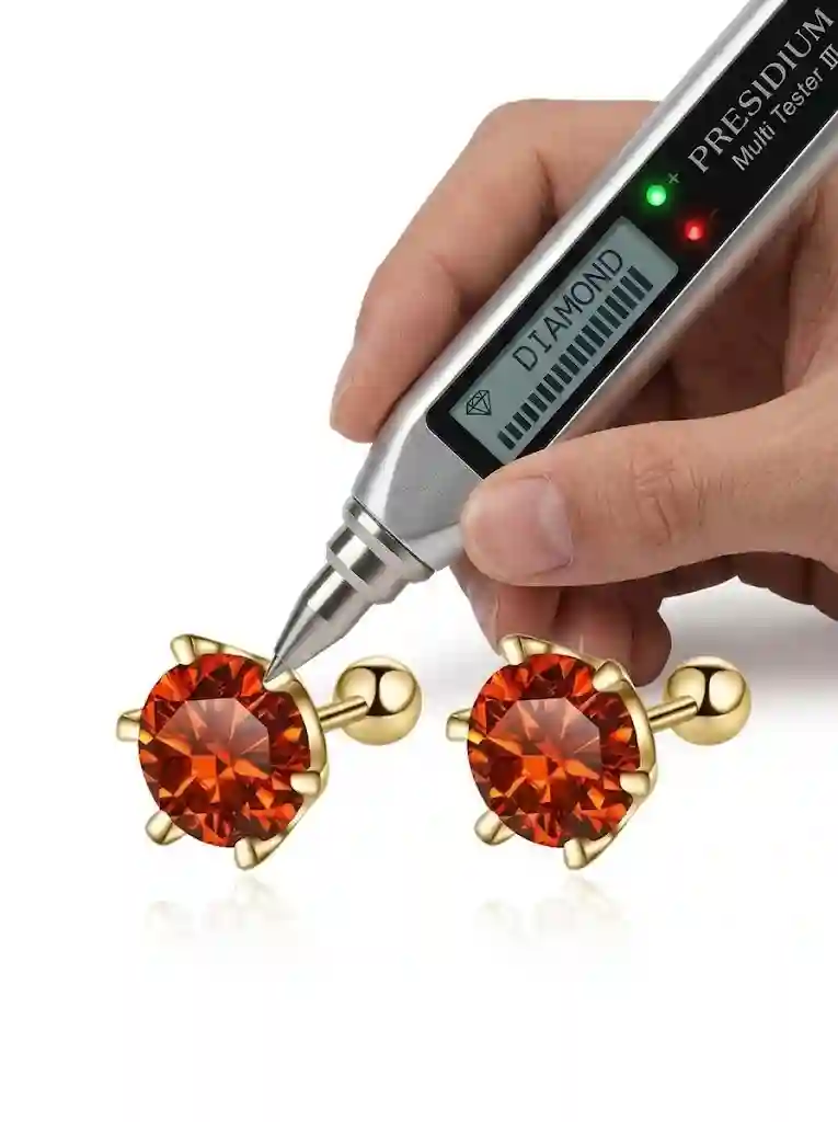 Diamond tester showing positive result on GRA certified moissanite stud earrings proving thermal conductivity identical to diamond