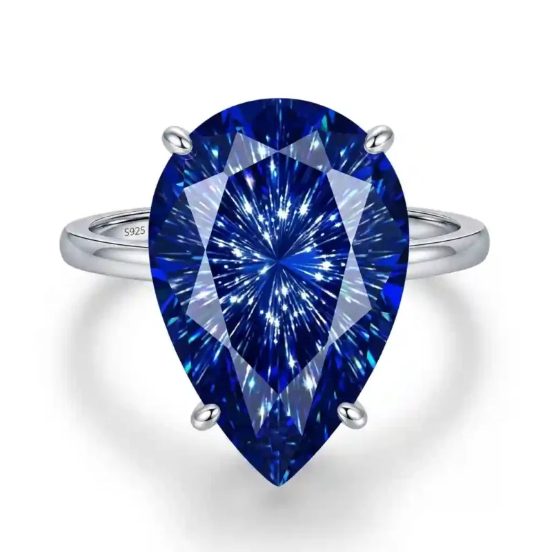 Fireworks-Cut teardrop gemstone ring in 925 sterling silver with triple-layered rhodium plating, showcasing 360° kaleidoscopic sparkle on hand.