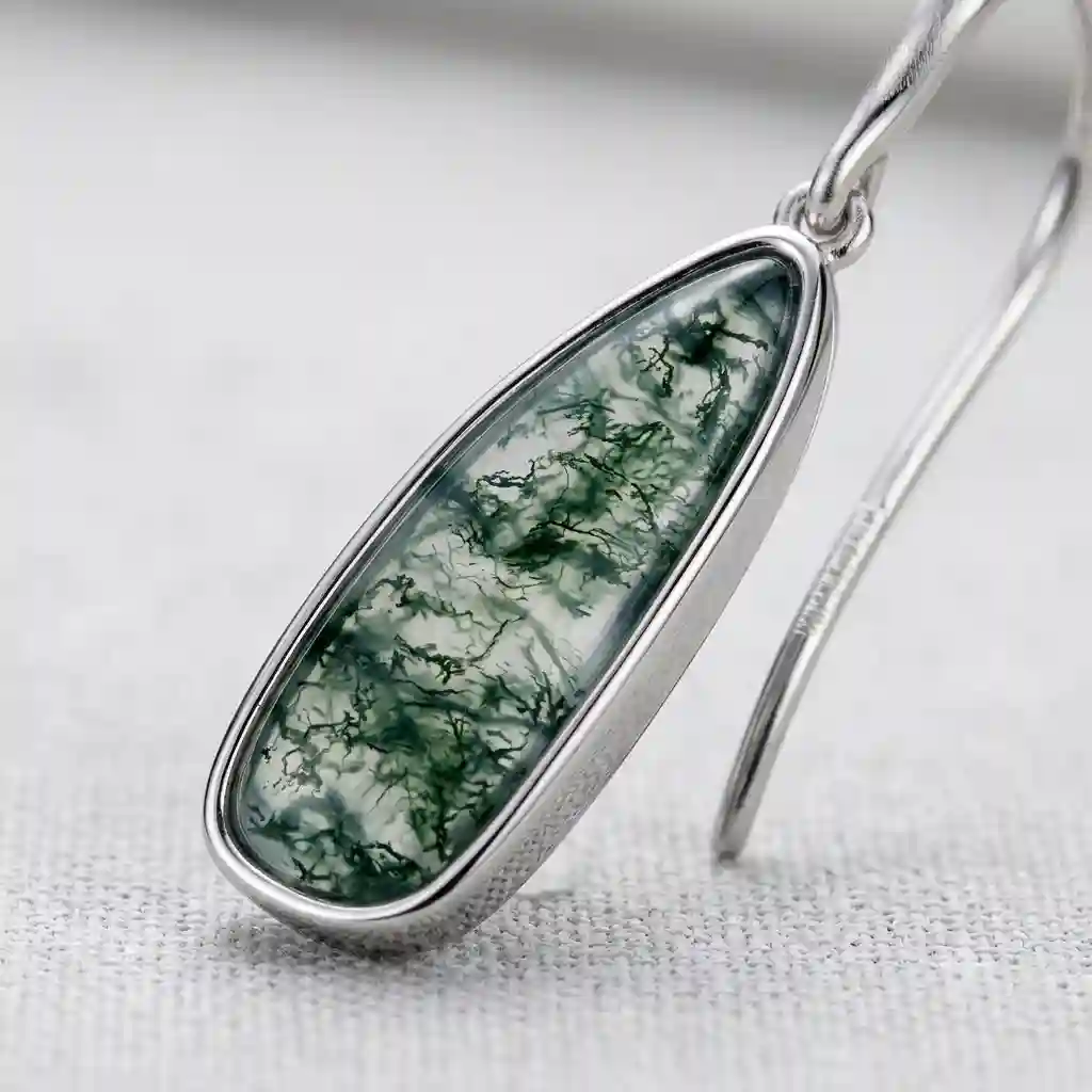Macro close-up MIRAMETAL ML-025194 moss agate earrings internal dendritic inclusions silver bezel French hook detail - moss stone earrings