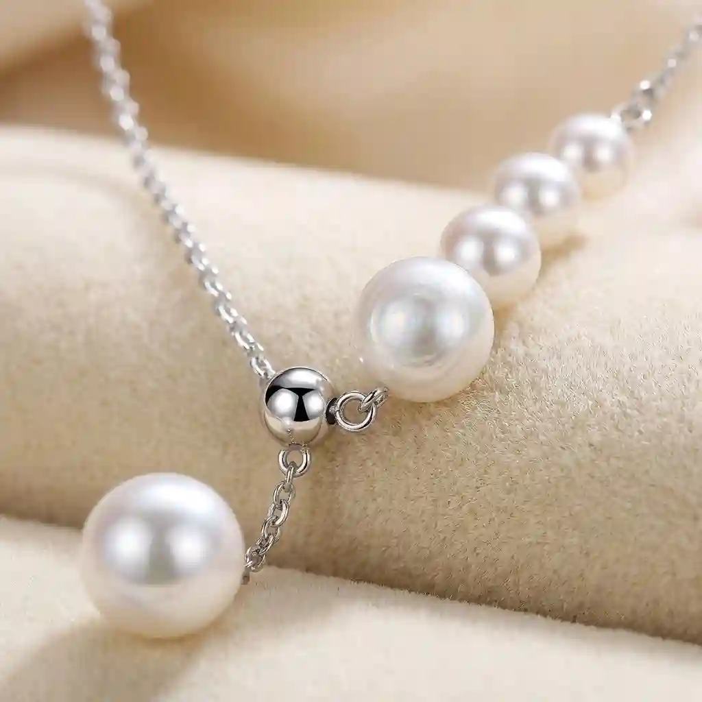 Pearl tassel Y-shaped necklace macro detail graduated pearls 925 silver asymmetric chain MIRAMETAL close-up jewelry photography