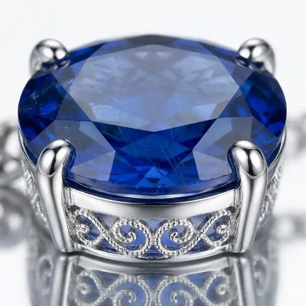natural gemstone necklace - Macro detail ML-051 MIRAMETAL natural sapphire pendant necklace showing oval cut cornflower blue stone four-prong setting and intricate filigree silverw