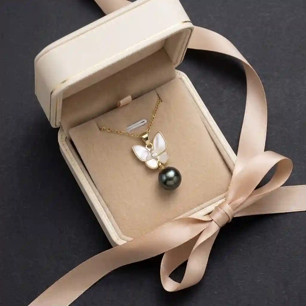 MIRAMETAL ML-0970 butterfly pearl necklace presented in a premium gold-rimmed leatherette gift box with a soft velvet interior. - butterfly fringe necklace