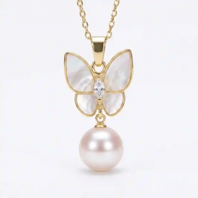 MIRAMETAL ML-0970 Butterfly Pearl Pendant Necklace, gold-plated 925 silver, with four white mother-of-pearl wings, a marquise-cut zircon center, and a round pearl drop, isolated on white background.