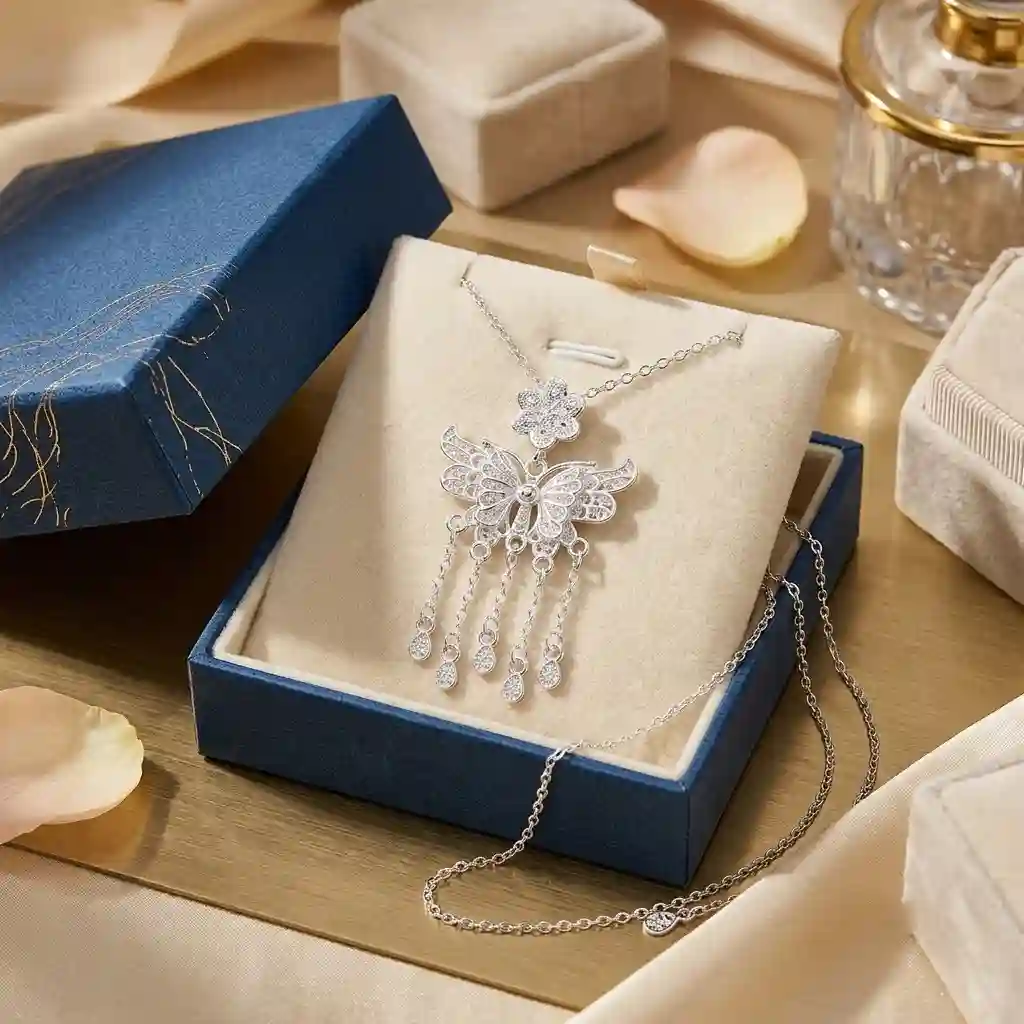 Luxury gift packaging for the MIRAMETAL butterfly pendant necklace in sterling silver with premium box and pouch