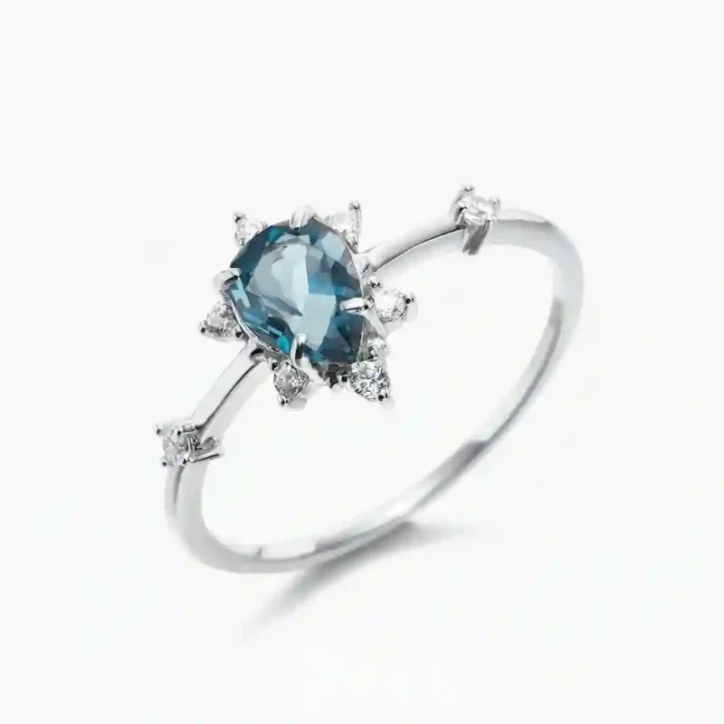 Pear-cut London blue topaz ring with white zirconia halo and side accents in 925 sterling silver – MIRAMETAL ML-583 hero image