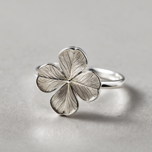 Sterling silver four-leaf clover ring macro showing fine leaf detail and veining