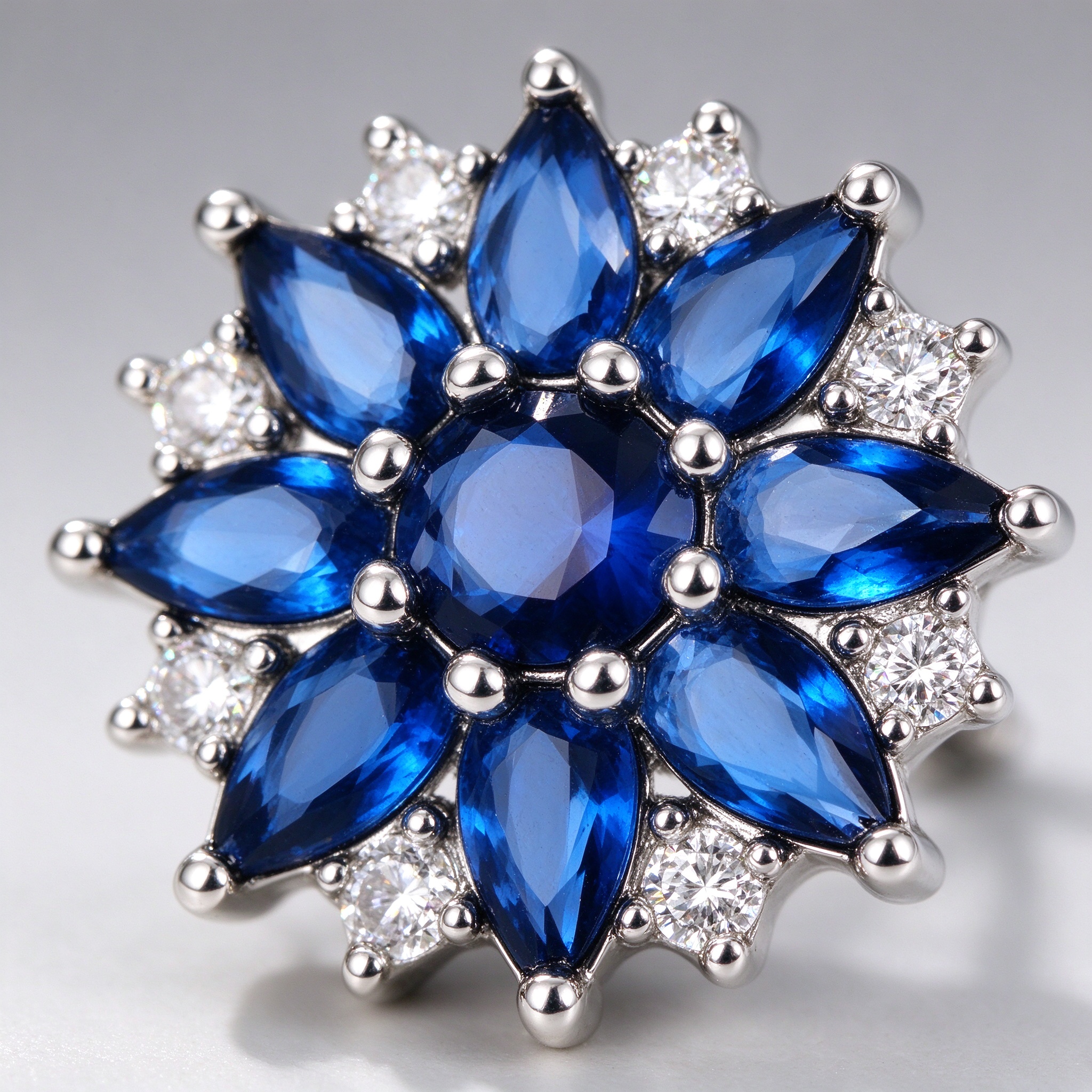 Macro detail of marquise blue spinel petals on sterling silver stud earring