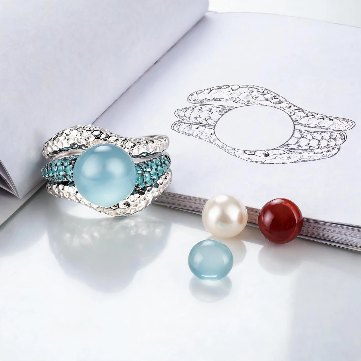 Gemstone ring design story with natural stones and sculptural band sketch
