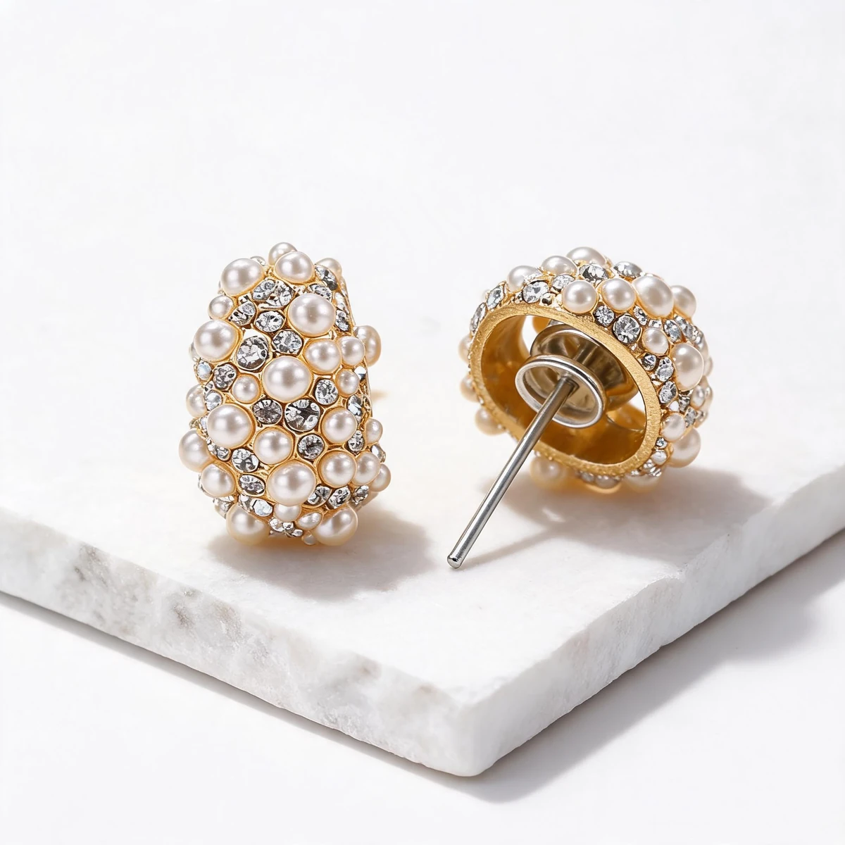 Close-up shell pearl cubic zirconia and gold setting material detail