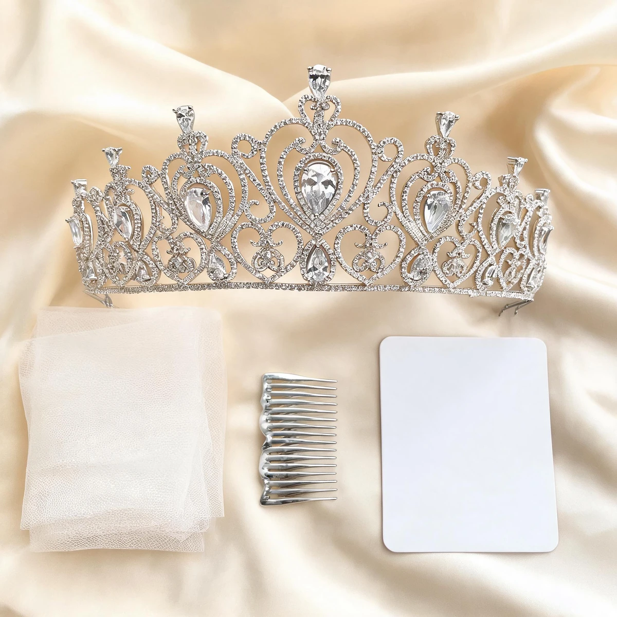 royal bridal crown styling flat lay with ivory veil