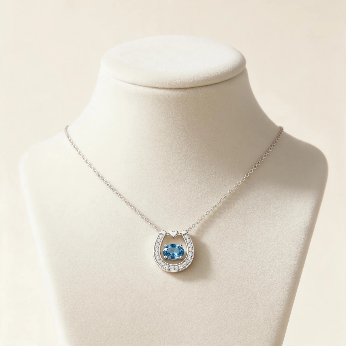 Blue Sapphire Horseshoe Pendant Necklace on Ivory Cashmere Jewelry Display Bust - 925 Sterling Silver Lifestyle View MIRAMETAL - blue sapphire necklace