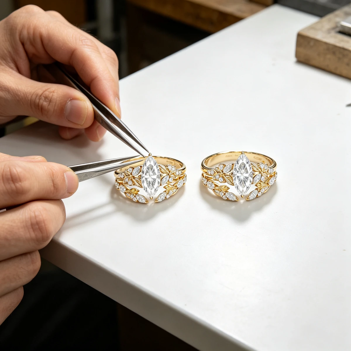 Jeweler finishing a marquise moissanite stacking ring set