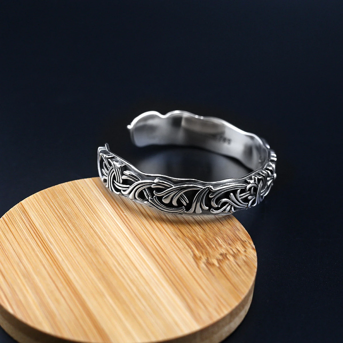 Sterling silver cuff bracelet inner band with S925 hallmark in a clean studio