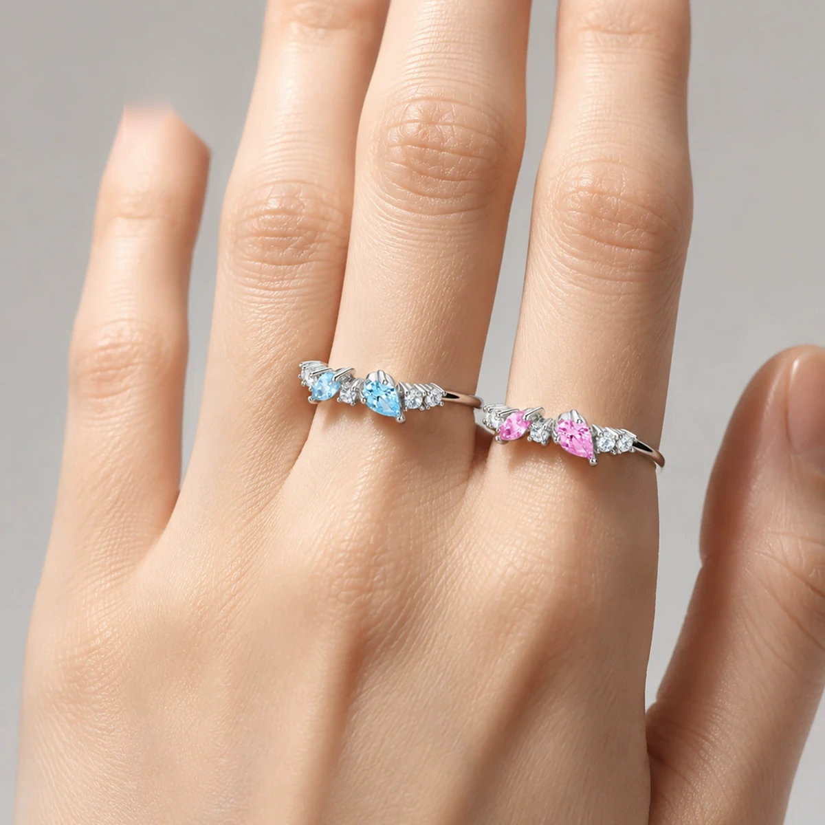 Woman wearing a colorful CZ silver stacking ring in 925 sterling silver
