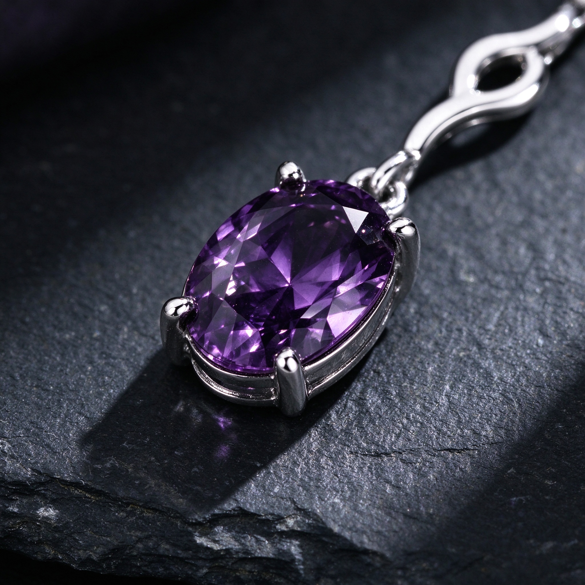 Amethyst bracelet macro close-up showing four-prong oval stone setting on 925 sterling silver