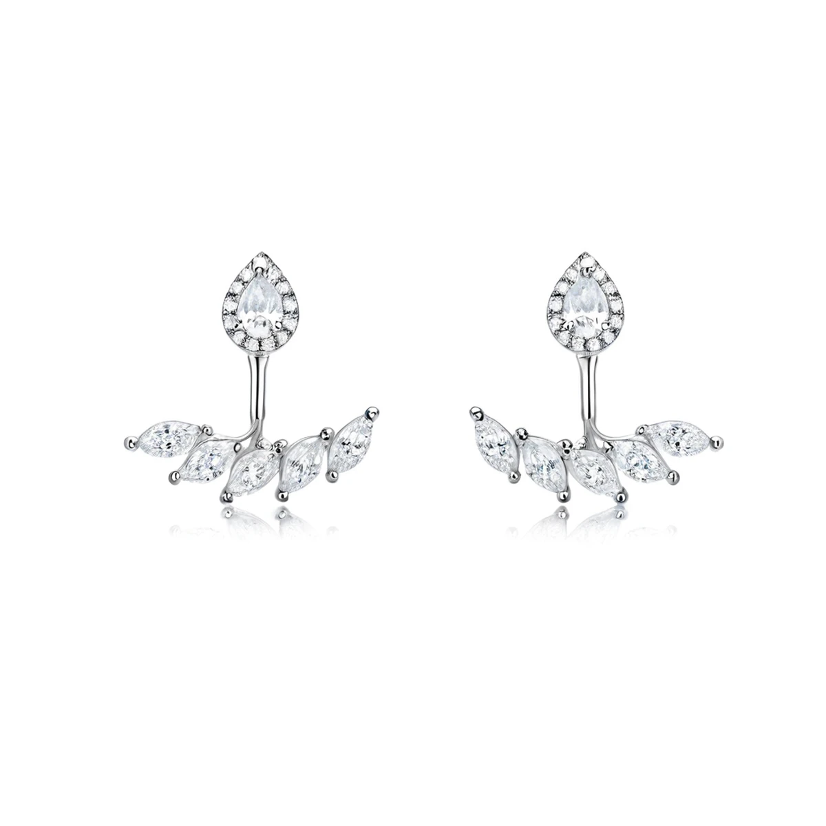 Close-up teardrop moissanite earrings macro with pear halo and marquise jacket