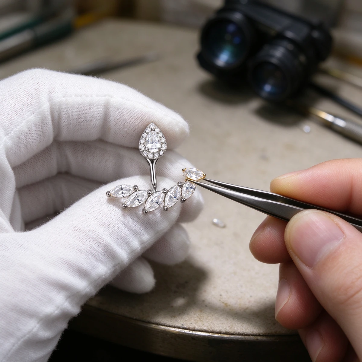 Teardrop moissanite earrings craftsmanship close-up of halo and marquise row