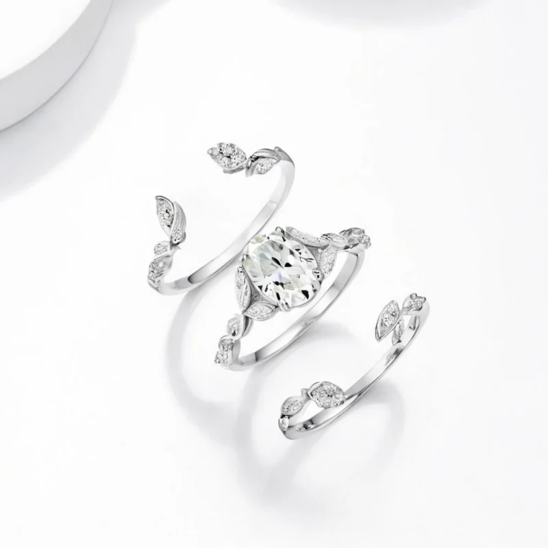 Three-piece moissanite stack ring set in925 sterling silver, oval centre on white - moissanite ring set