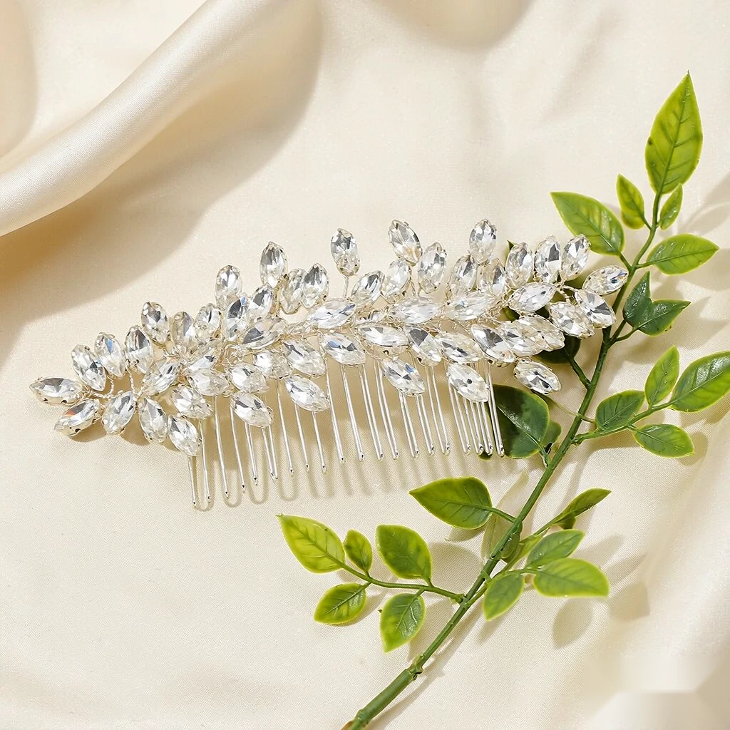 Silver leaf-vine bridal hair pieces set with marquise crystals laid on ivory silk