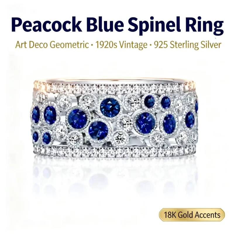 Front view of wide Art Deco peacock blue spinel ring with round blue stones and clear pavé stones in 925 sterling silver with 18K gold accents on white background
