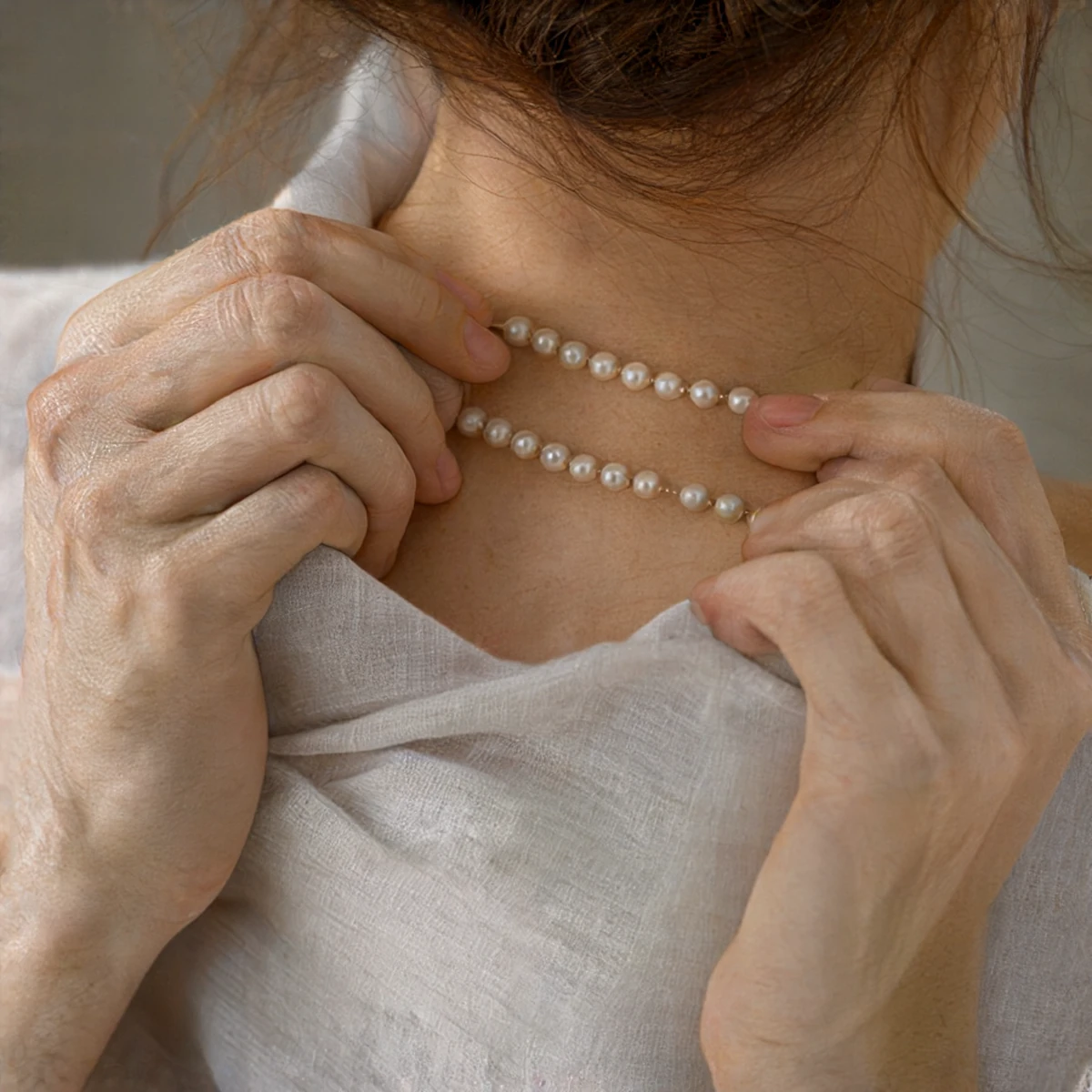 Western Model Wearing the S925 Silver Peanut Bead Necklace as a Choker and Layered Over a Crew Neck