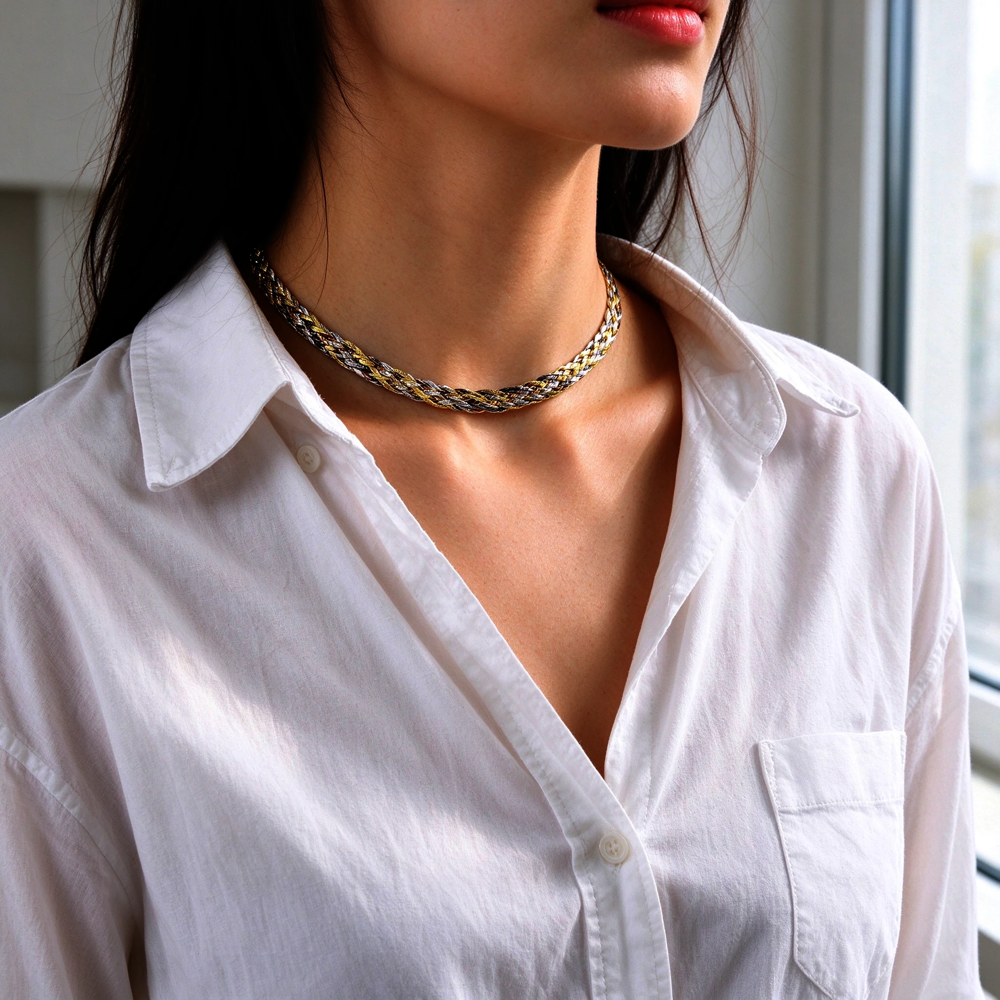 Woman wearing the braided silver necklace — tri-color 925 silver choker with white shirt