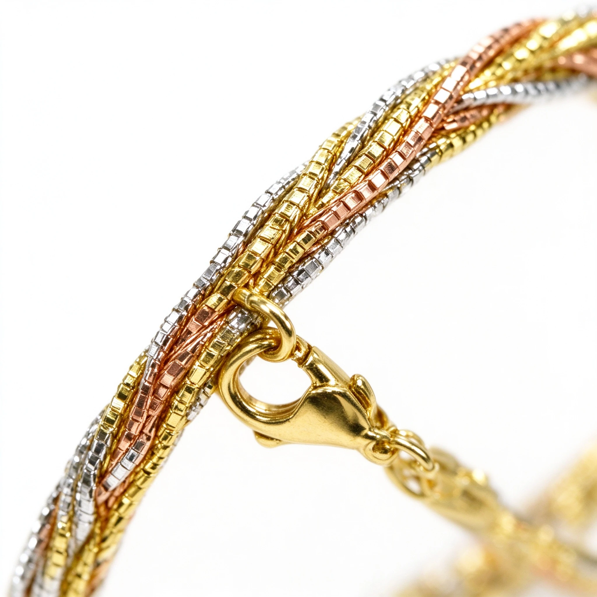 Close-up of tri-color braided 925 sterling silver bracelet with lobster clasp - braided silver bracelet