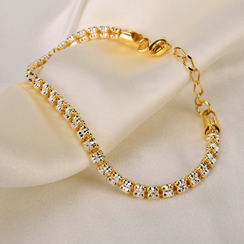 S925 silver bracelet side angle — diamond-cut three-row laser beads with 18K gold + rhodium two-tone finish